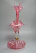 A Victorian cranberry glass four vase table centrepiece,52 cms high.