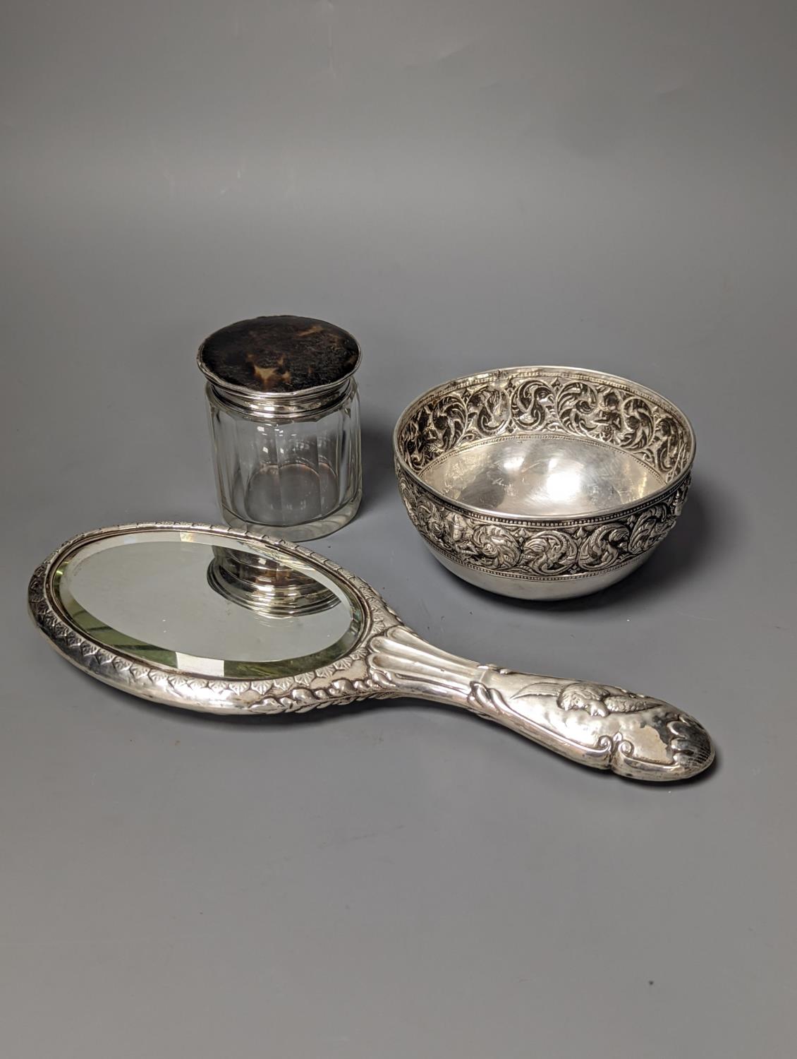 An Edwardian silver mounted 'Reynold's Angels' hand mirror, a silver and tortoiseshell lidded - Image 2 of 2