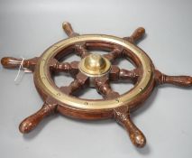 A hardwood and brass mounted Ship's wheel, signed Lawrence Simpson 50cm