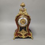 A Louis XV style ormolu mounted scarlet Boulle eight day mantel clock with key and pendulum 34cm
