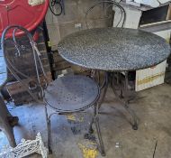 A circular stone top garden table, diameter 75cm, height 72cm and two chairs