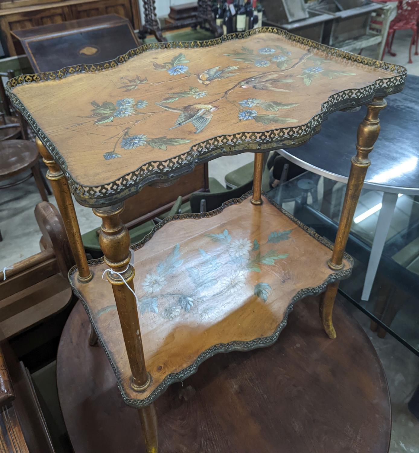 A late Victorian two tier walnut etagere, painted with birds amongst flowers, width 58cm, depth