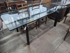 Mid century design. An LC6 style rectangular glass top dining table, length 210 cms, width 85 cms,