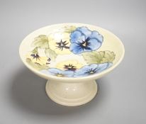 A Moorcroft pansy designed, yellow ground comport, stickered and sighed to underside,
