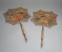 A pair of early Victorian petite point and cut steel hand screens,39 cms high.