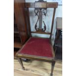 A pair of Edwardian inlaid mahogany lyre back chairs