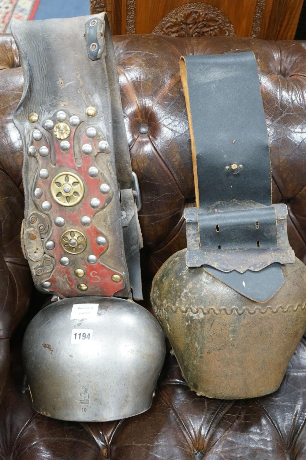 Two large French or Swiss vintage cow bells, larger 26cm, height 22cm