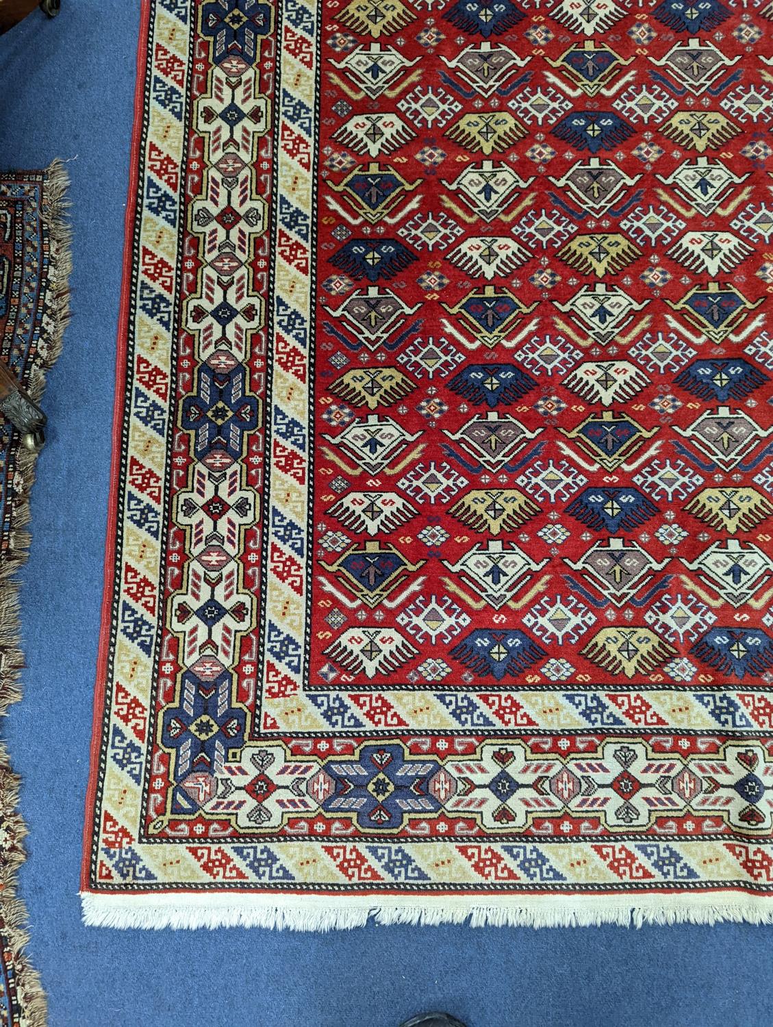 A Caucasian style red ground rug, 210 x 140cm - Image 2 of 5