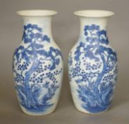 A pair of 19th century Chinese blue and white three friends of winter vases 22cm