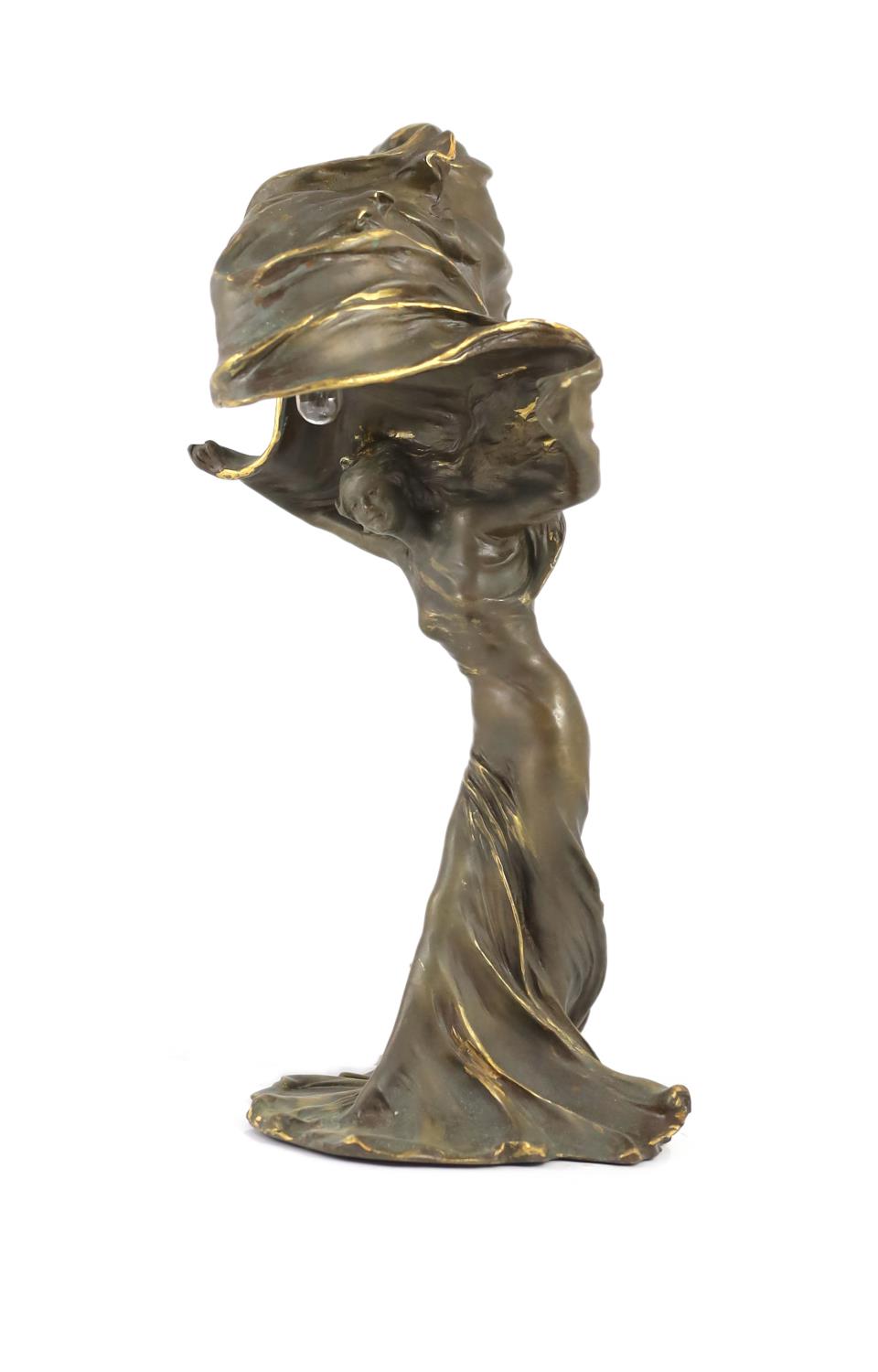 After Raoul Larche (1860-1912). A bronze 'Loie Fuller' table lamp,the dancer with raised arms,