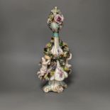 A German porcelain floral encrusted vase and cover 35cm, pseudo crossed swords mark