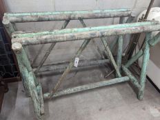 A pair of provincial painted wood trestle bases, length 106cm, height 78cm