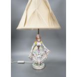 A German porcelain ‘dancing lady’ lamp,figure 29 cms high.