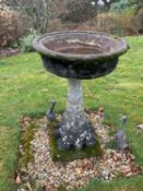 A circular reconstituted stone bird bath, diameter 56cm, height 89cm