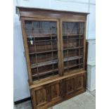 A George III style mahogany library bookcase, width 154cm, depth 38cm, height 217cm