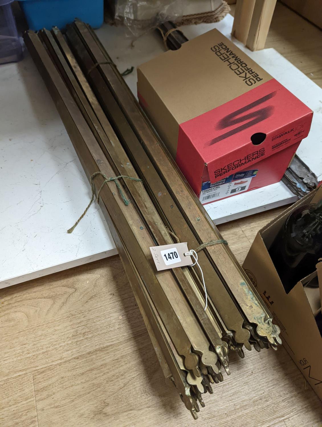 Two sets of brass stair rods with fittings