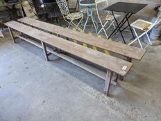 A pair of 19th century French provincial oak long bench seats, length 300cm, depth 24cm, height