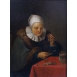 18th century Flemish School Woman seated at a table counting moneyoil on wooden panel18.5 x 14cm