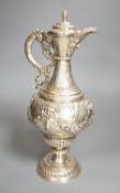 A 19th century Continental white metal wine ewer, embossed with swags and masks, height 29.9cm, 16.