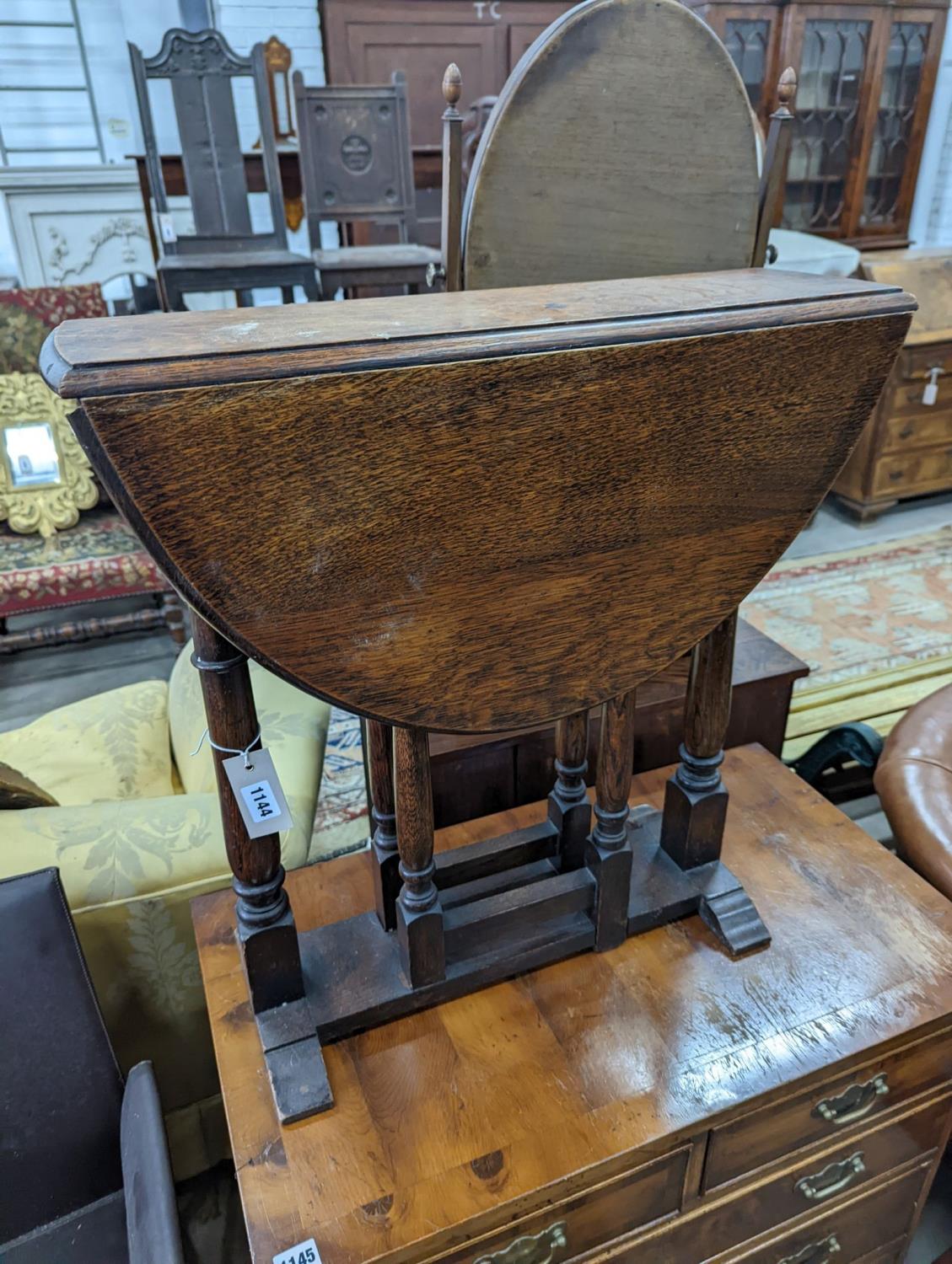 An 18th century style oak drop flap occasional table, width 60cm, height 62cm