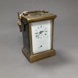 A brass cased carriage clock, with key. 16cm
