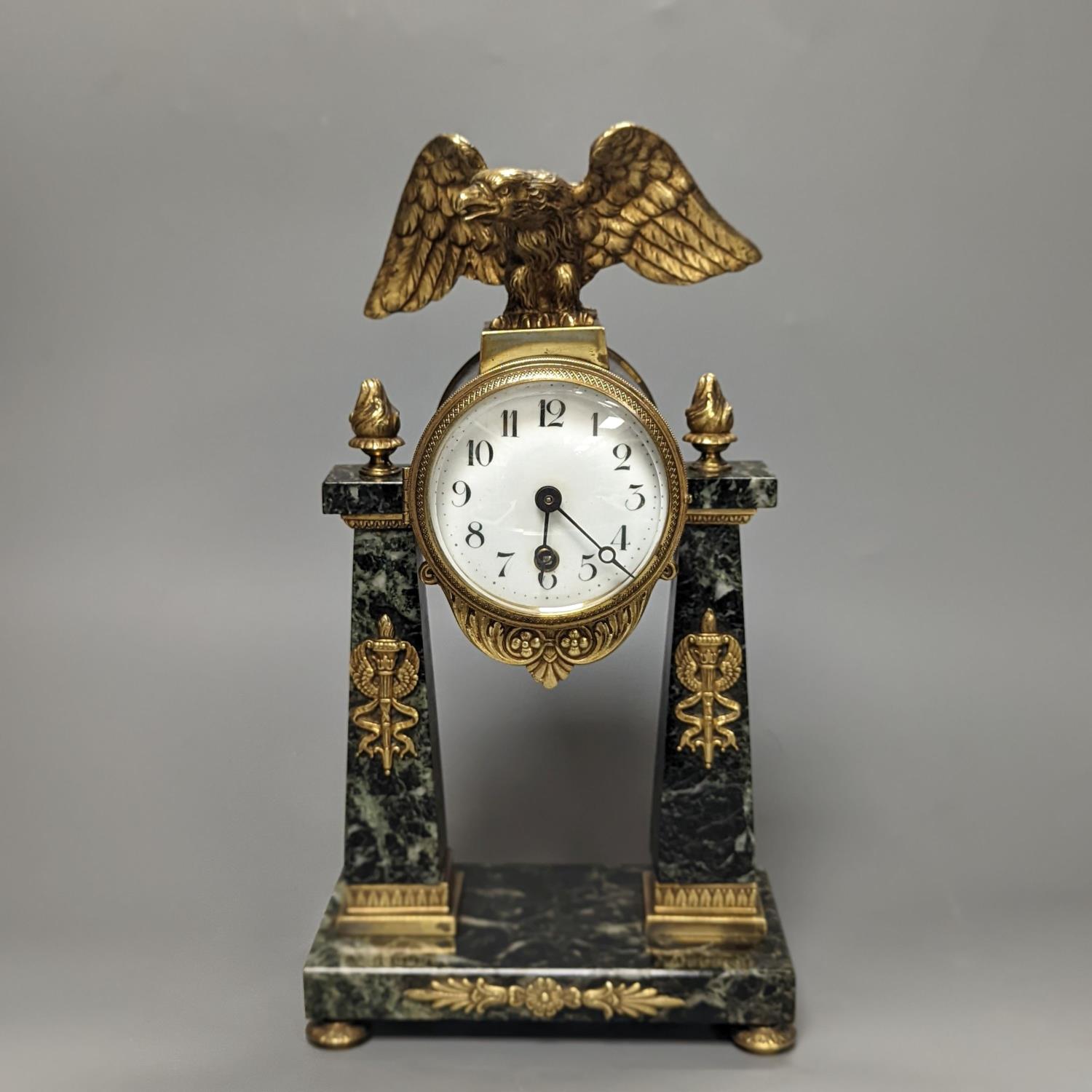 A French Empire style marble and ormolu portico timepiece 32cm