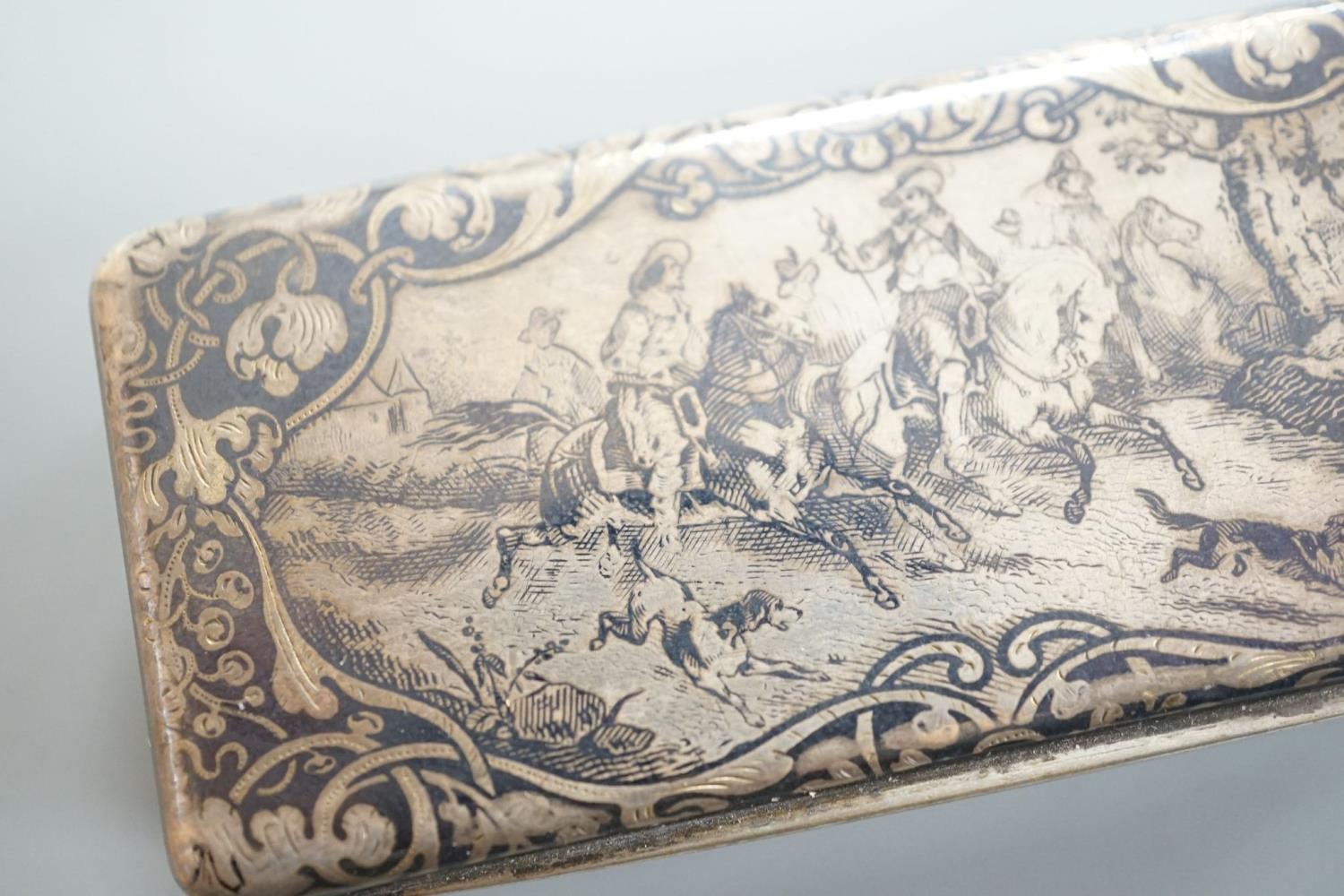 A 19th century French white metal and niello snuff box, 78mm, decorated with hunting scene. - Image 2 of 5