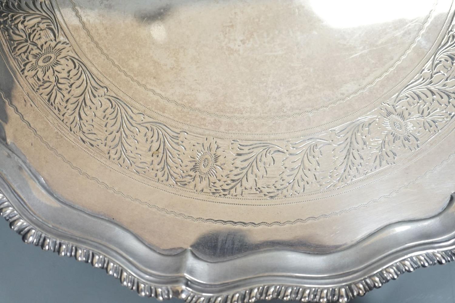 A George III silver salver, with gadrooned border, on three shell feet, Ebenezer Coker, London, - Image 2 of 5