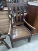 An Arts and Crafts elbow chair, width 61cm, depth 45cm, height 106cm