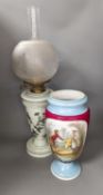 A late 19th century French enamelled green glass oil lamp and glass shade and a Paris porcelain