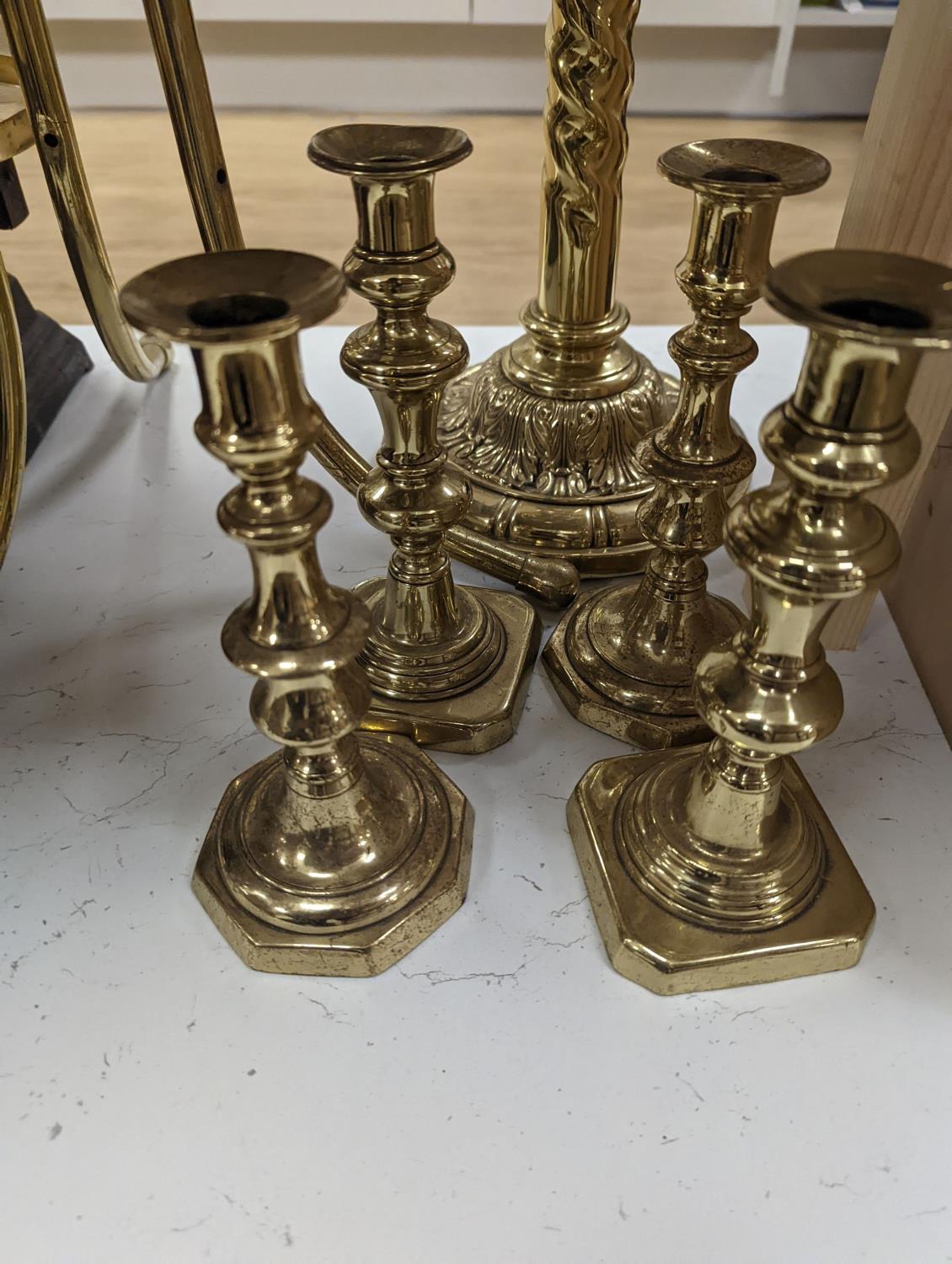 A brass magazine stand, a pair of scales, four candlesticks and a tall brass oil lamp base,Oil - Image 2 of 4