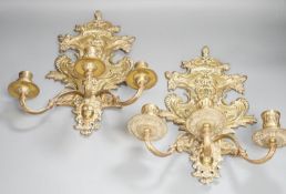 A pair of French ornate brass three branch wall sconces,37 cms high,