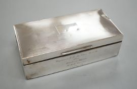 A late 1950's engine turned silver mounted rectangular cigarette box, with engraved inscription,