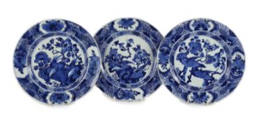 A set of three Chinese blue and white ‘pheasant’ large plates, Kangxi period,each painted with