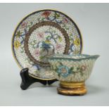 A Chinese plique a jour enamel cup and saucer 13cm diameter