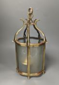 A brass hall lantern and a circular brass ceiling light fitting,hall lantern 40 cms high.