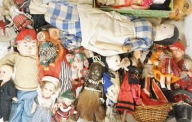 A quantity of bisque headed dolls,a collection of miniature and world dolls, a large bisque headed