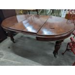 A Victorian mahogany extending dining table, length 170cm extended (two spare leaves), width