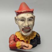 A cold painted cast iron ‘jester’ money bank 17cm