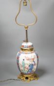 A European porcelain table lamp in the Oriental style,63 cms high.