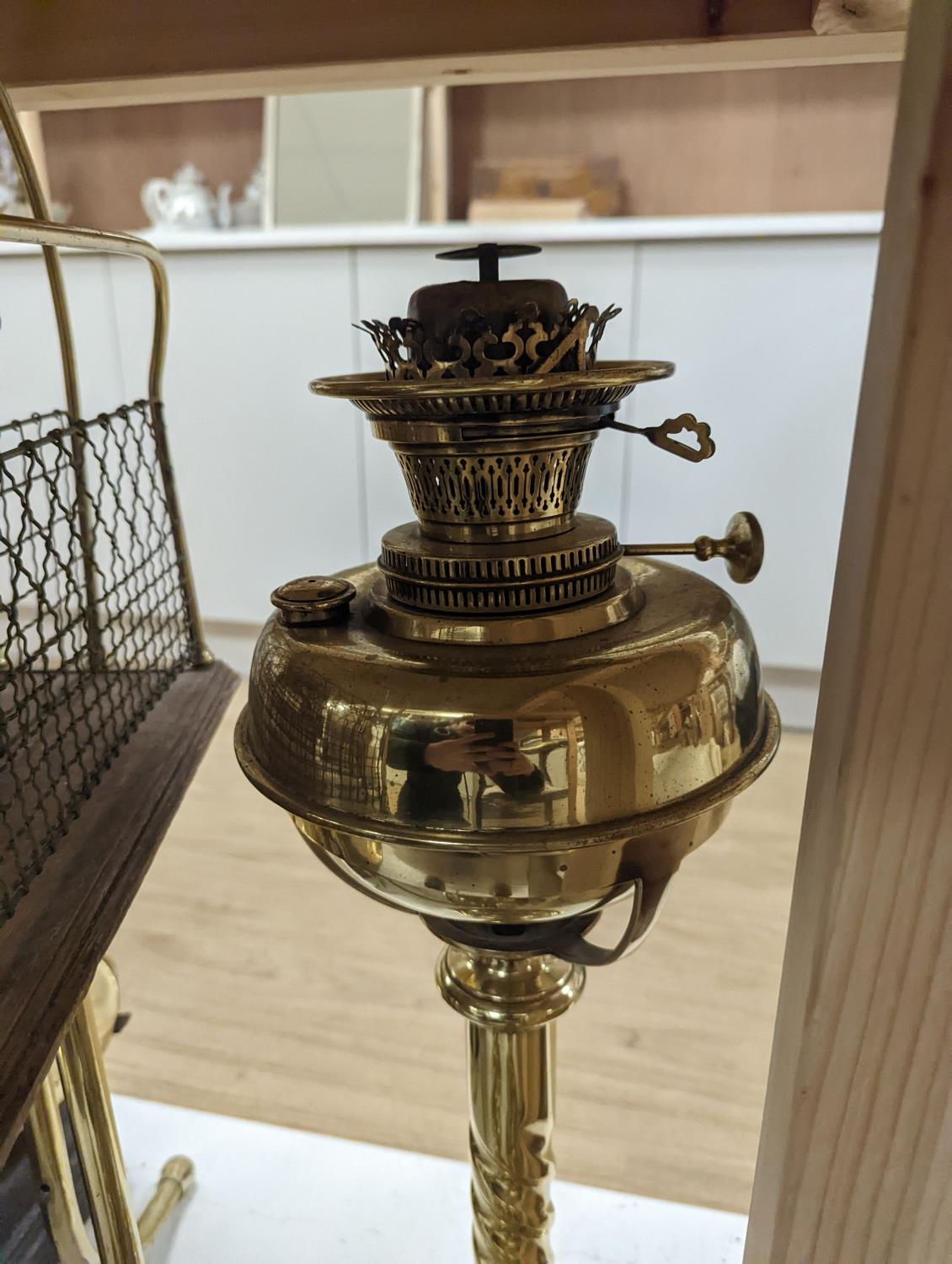 A brass magazine stand, a pair of scales, four candlesticks and a tall brass oil lamp base,Oil - Image 4 of 4