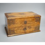 A Victorian oak smoker's box, with brass mounting,30 cms wide x 17 cms high.