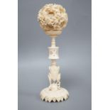 An early 20th century Chinese ivory concentric puzzle ball and stand 20cm total height