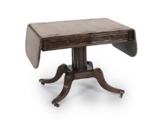 A Regency brass inset rosewood sofa tableWith D shaped flaps and two freize drawers, on octagonal