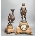 A spelter and marble figural mantel clock and a matching vase 47cm