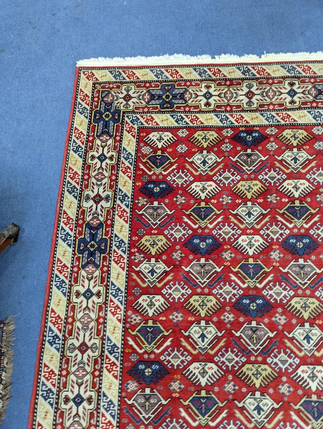 A Caucasian style red ground rug, 210 x 140cm - Image 5 of 5