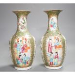 A pair of 19th century Chinese famille rose vases,24 cms high.