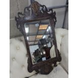 A George II style parcel gilt fret cut wall mirror, width 44cm, height 81cm