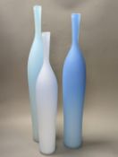 Three contemporary blue glass bottle vases,tallest 55cms high.