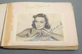 A 1930-40's autograph album including Judy Garland, Spencer Tracy, Basil Rathbone etc. and a photo